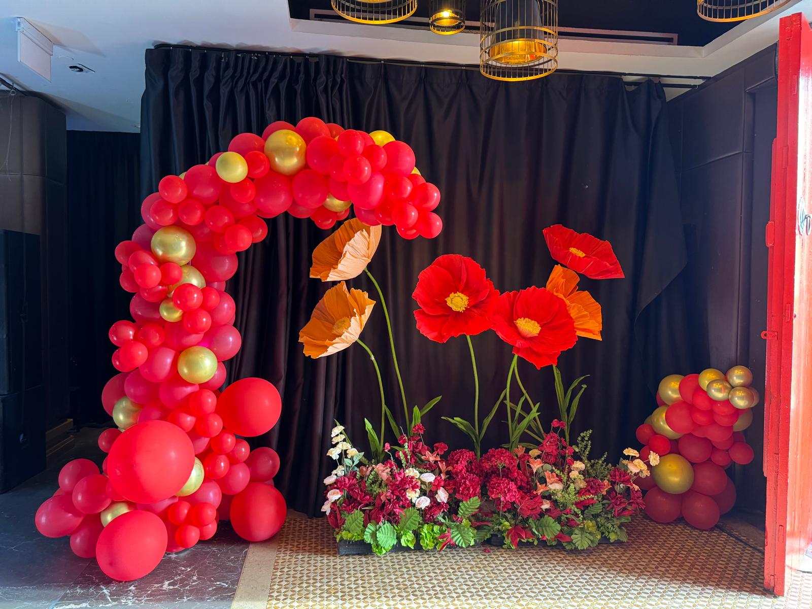 Balloon arch with giant floral styling by Bespoke Events