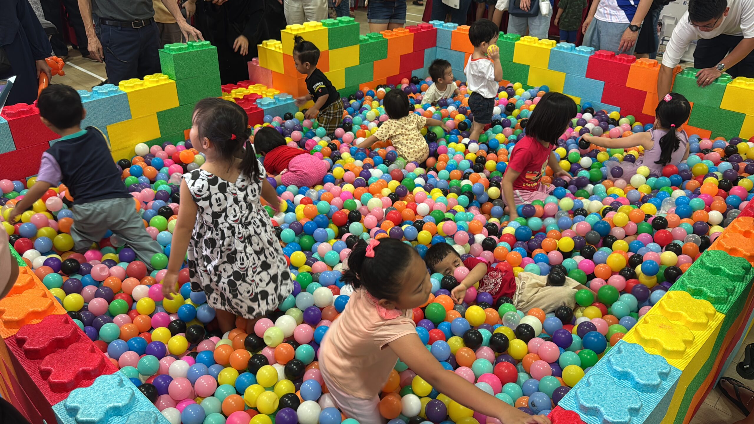 Children playing in a giant LEGO ball pit at a Bespoke Events carnival
