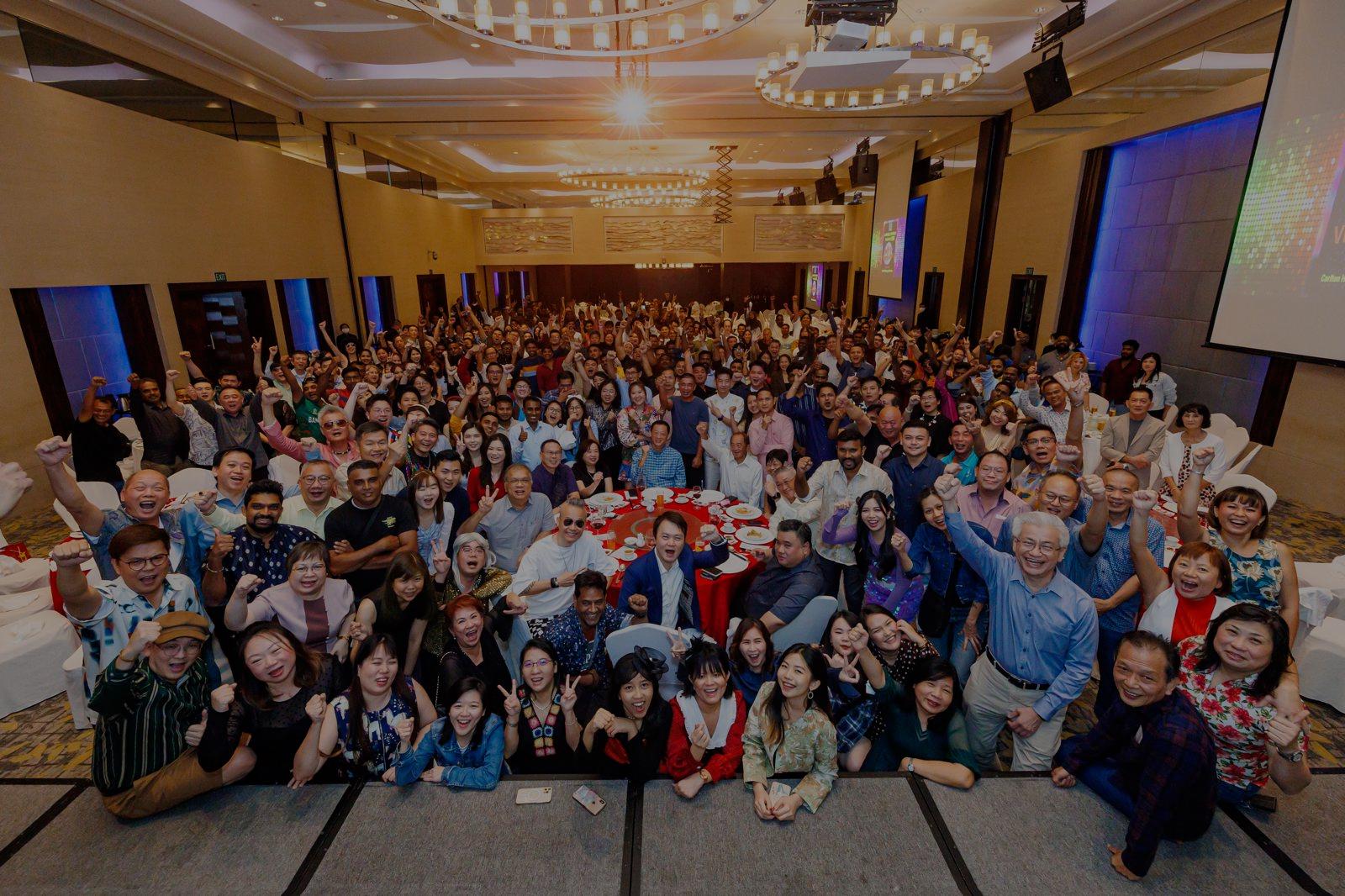 Hundreds of guests cheering at a Bespoke Events celebration