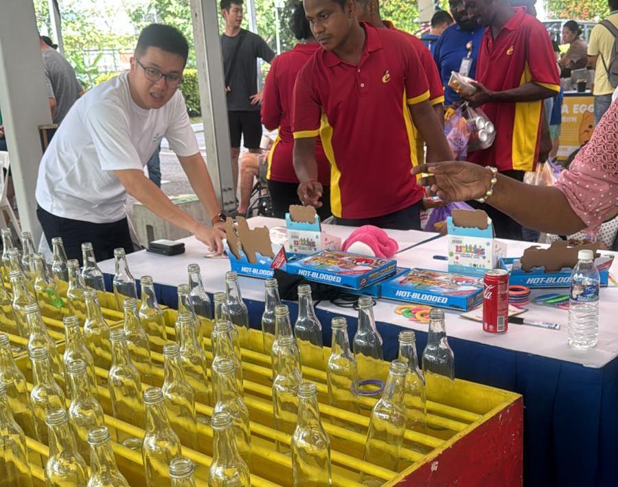 Ring toss bottle game at a Bespoke Events carnival booth